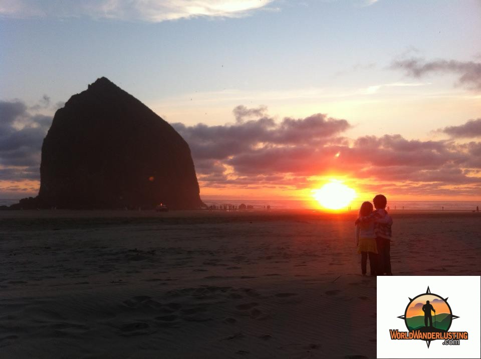 Miles and Belle at Haystack Rock on the Oregon Coast